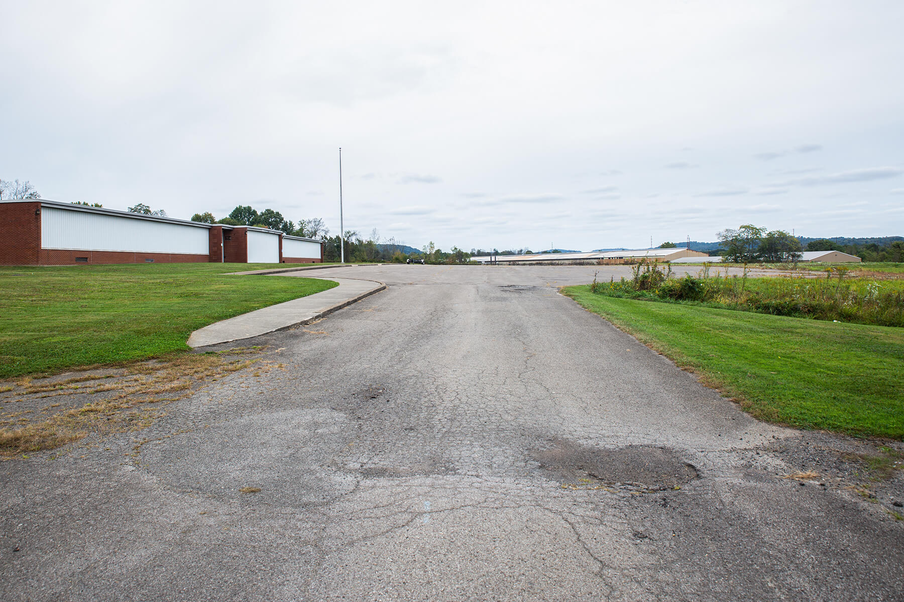 The grounds of the shuttered elementary school in Tyrone Zeigler’s childhood home of Koppel, Pa. The basketball court and playground that were once on the property no longer exist.