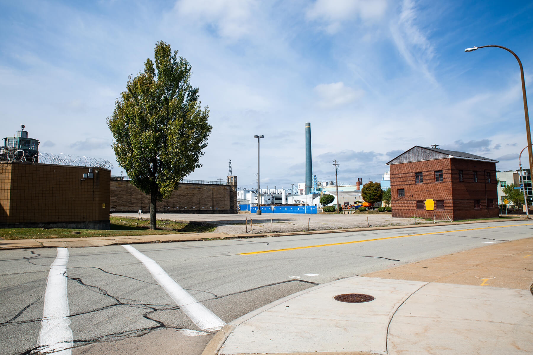 Beaver Avenue in the Woods Run area of Pittsburgh, located in Allegheny County District 13. The State Correctional Institution–Pittsburgh (pictured left) was closed in 2017, but it operated in this location as the Western Penitentiary from 1882-2005. The Allegheny County Sanitary Authority (ALCOSAN) complex (pictured center) was opened adjacent to the prison in 1959, as the largest water sewage treatment center in the United States to that date. The aging city infrastructure contributes to ongoing water quality issues.